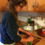 Carly cutting scallions for potato salad